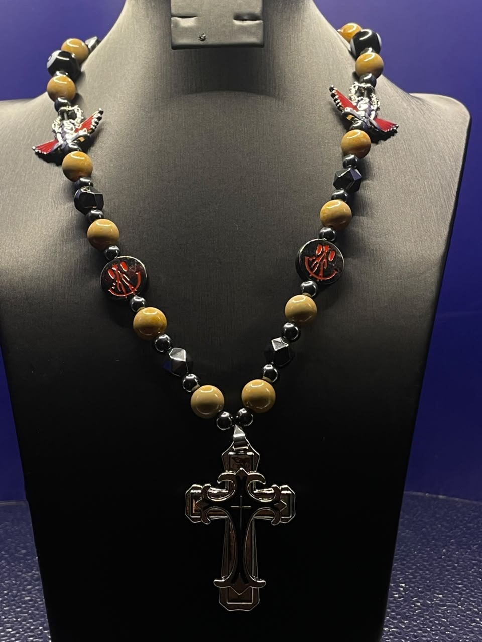 The Sovereign Cross Necklace — tiger eye, onyx and crimson enamel beads with silver cathedral cross pendant