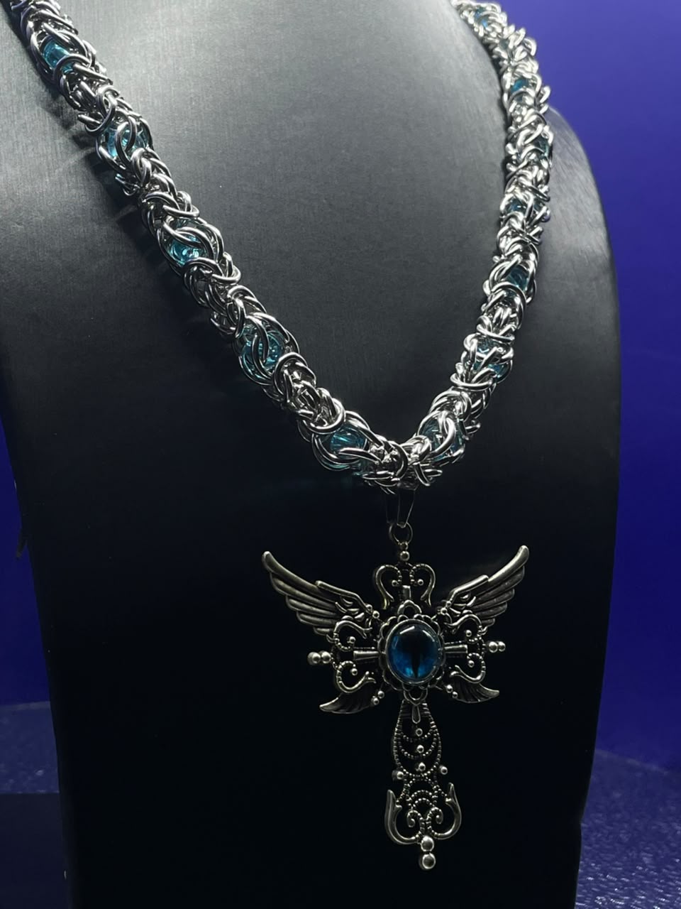The Fallen Angel Chain — Byzantine silver and teal chain with winged gothic cross and blue gemstone pendant
