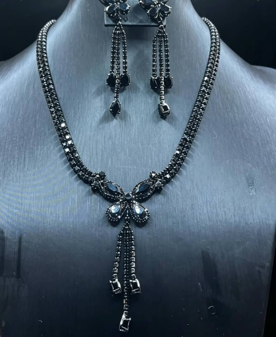The Noir Cascade Set — black crystal tennis necklace with tassel drop and matching earrings